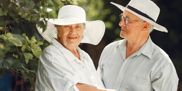 beautiful-old-couple-spend-time-in-a-summer-garden-2022-06-09-15-20-45-utc