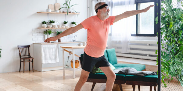 senior-man-doing-yoga-wellbeing-and-wellness-con-2022-03-09-03-05-59-utc